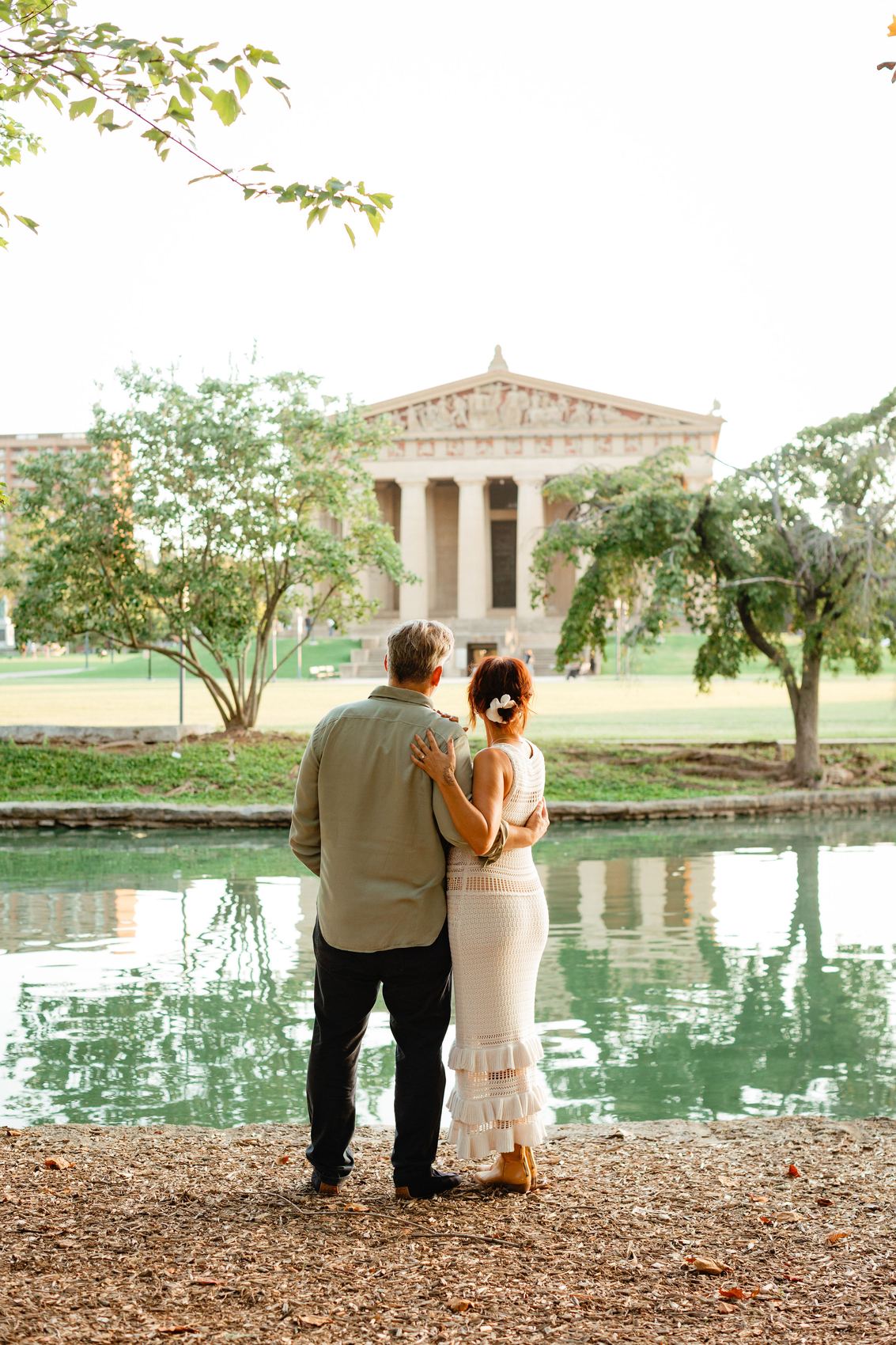 Danielle and Patrick from behind, arm in arm, looking at the Parthenon replica in Nashville