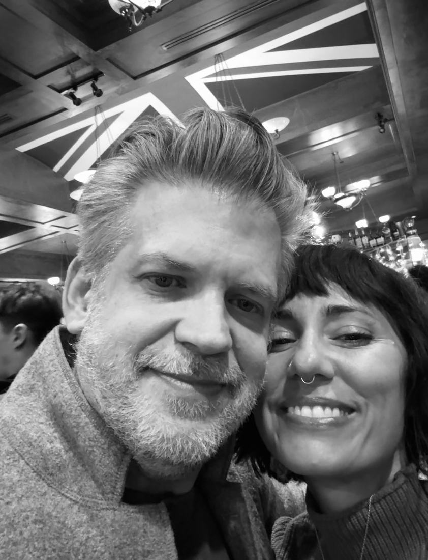 Black and white close portrait of Danielle and Patrick smiling together