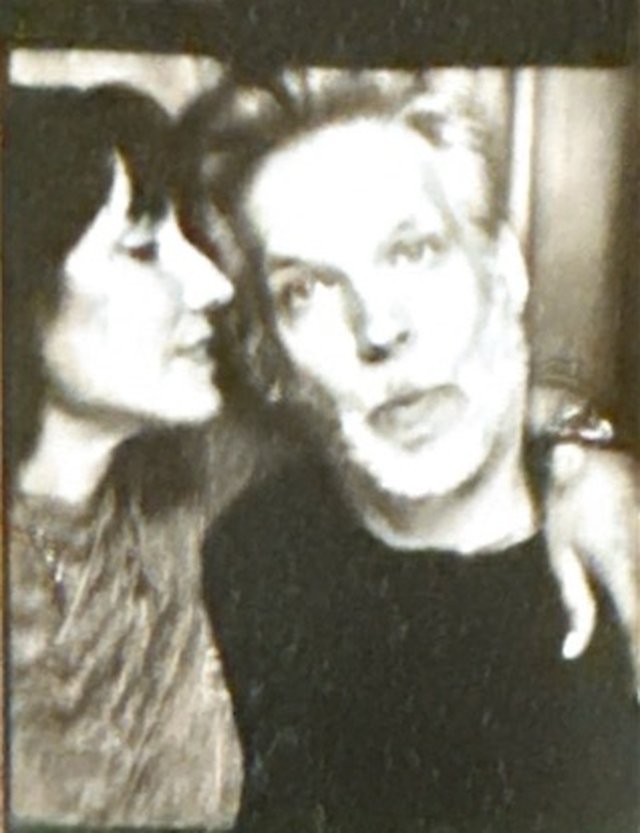 Photobooth frame of Danielle and Patrick in profile