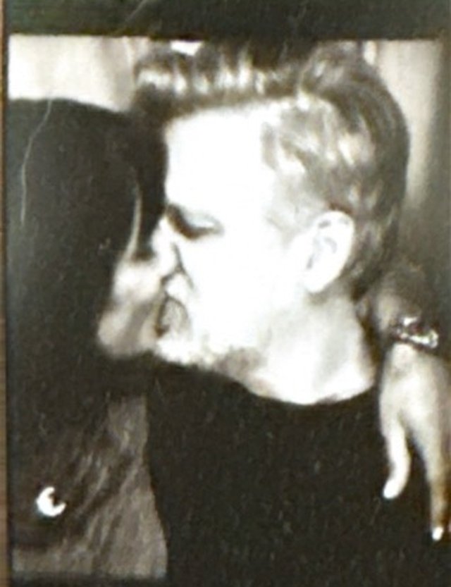 Photobooth frame of Danielle kissing Patrick's cheek